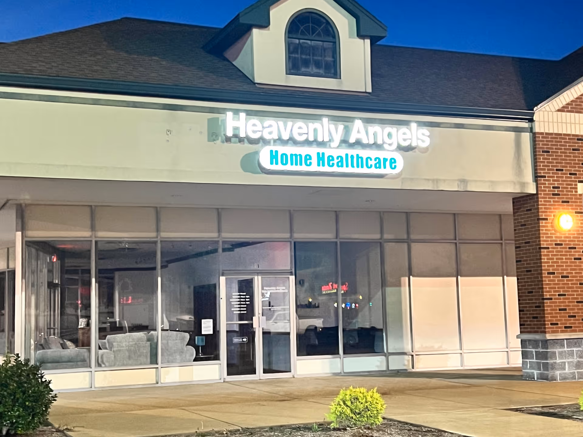Storefront of Heavenly Angels Home Healthcare with glass windows and visible seating inside.