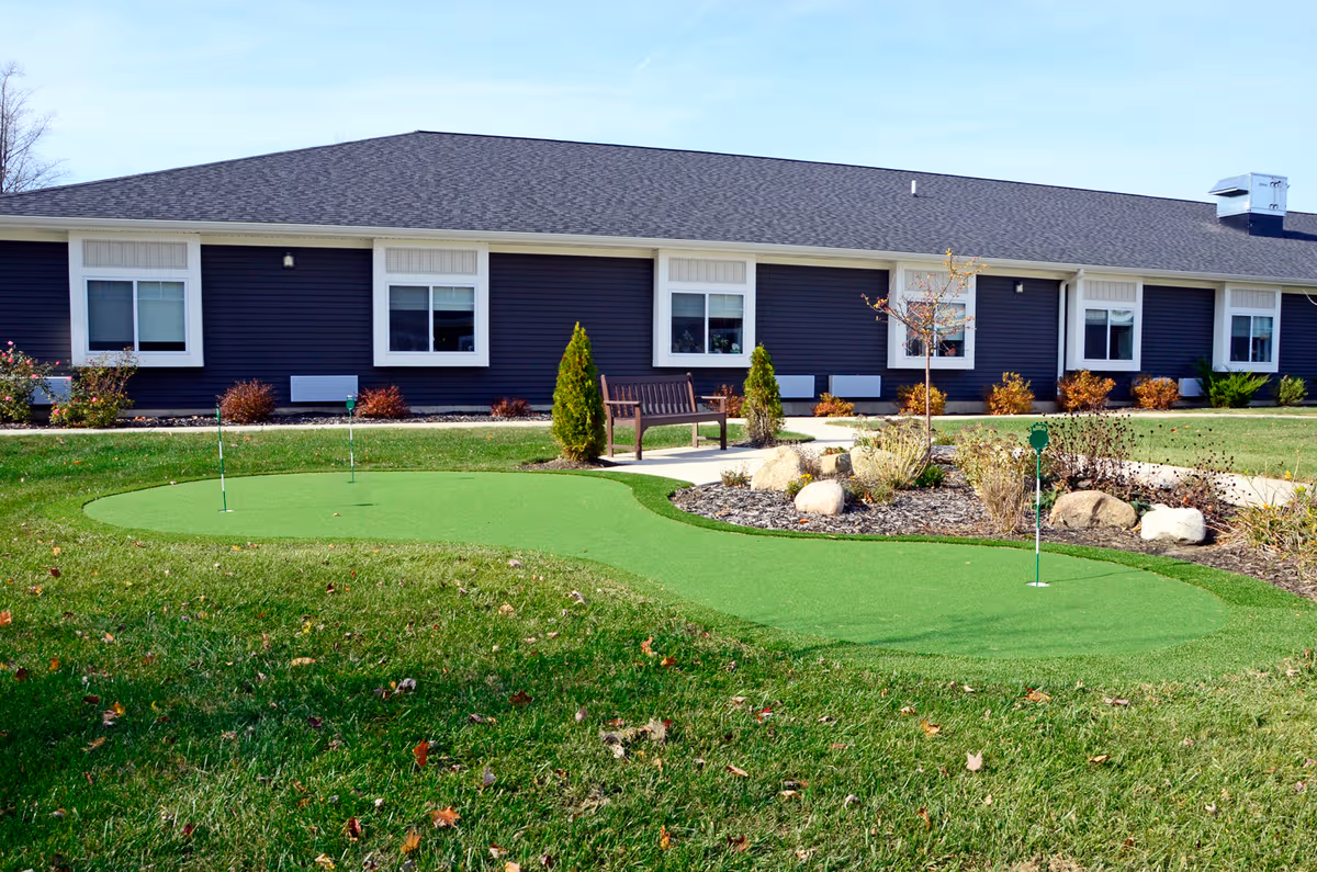 Exterior view of Laurel Oaks of South Haven with an outdoor mini-golf putting green.