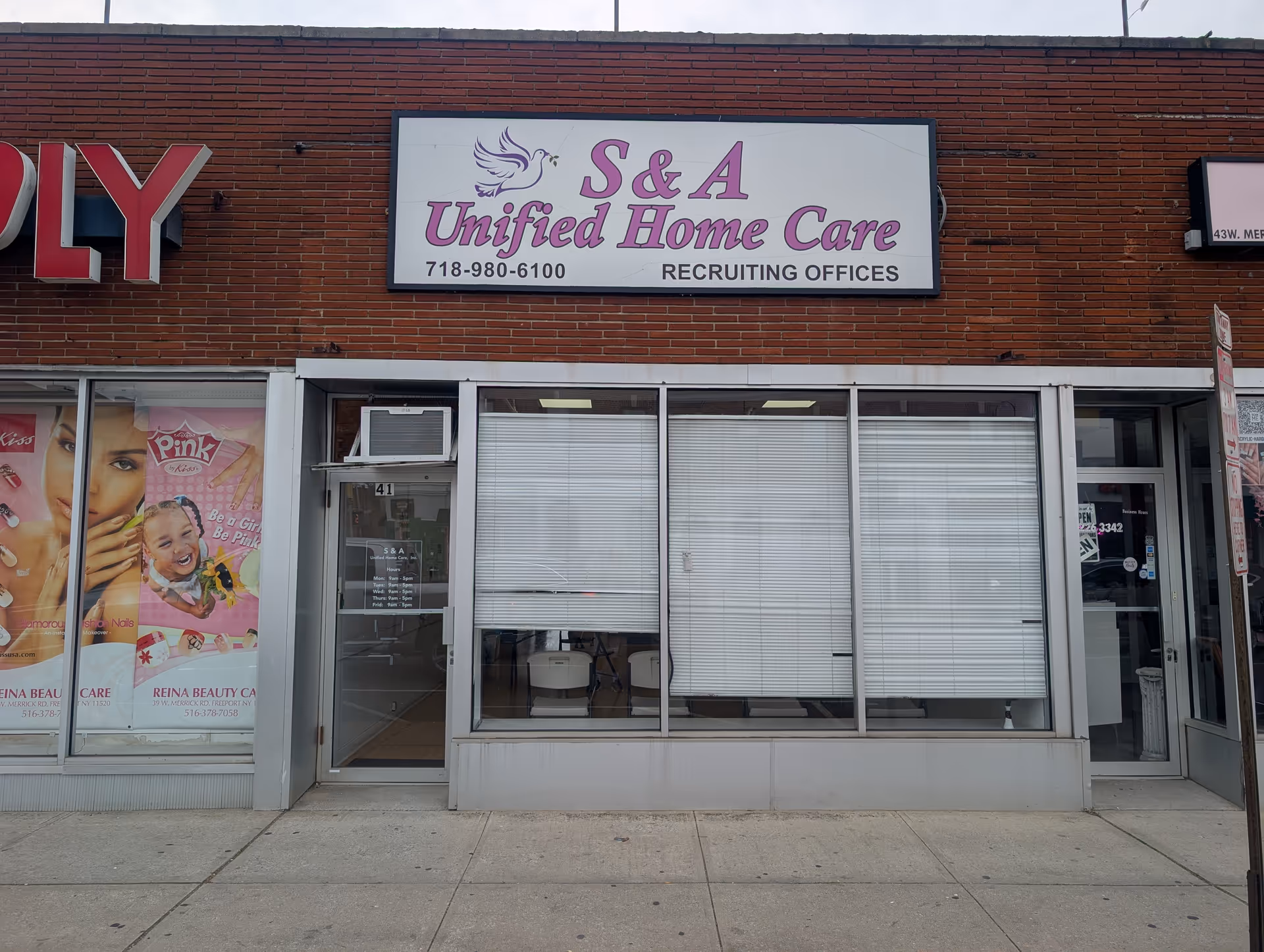 S & A Unified Home Care storefront with large window blinds and sign.