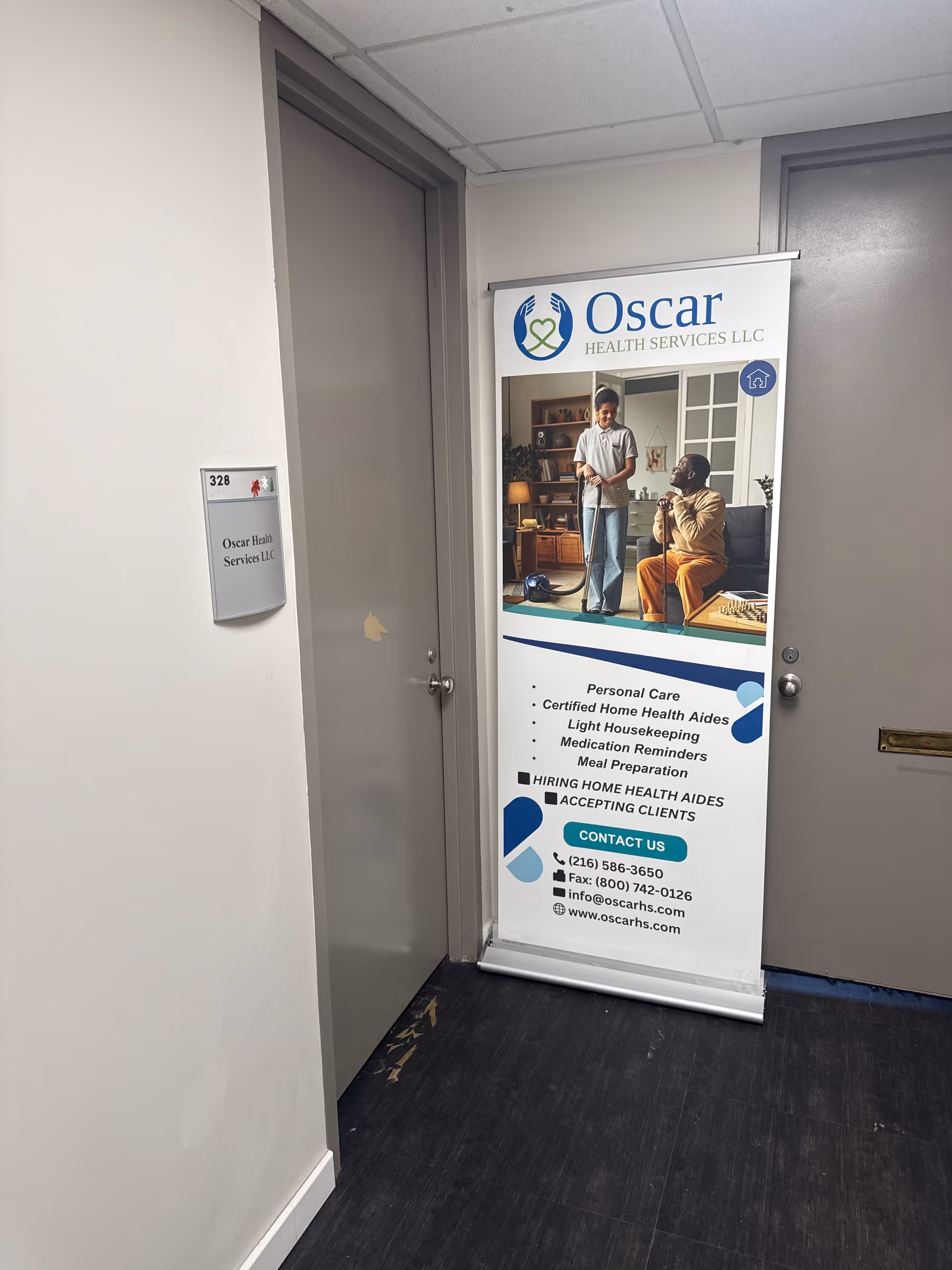 Indoor hallway featuring an Oscar Health Services banner beside a doorway