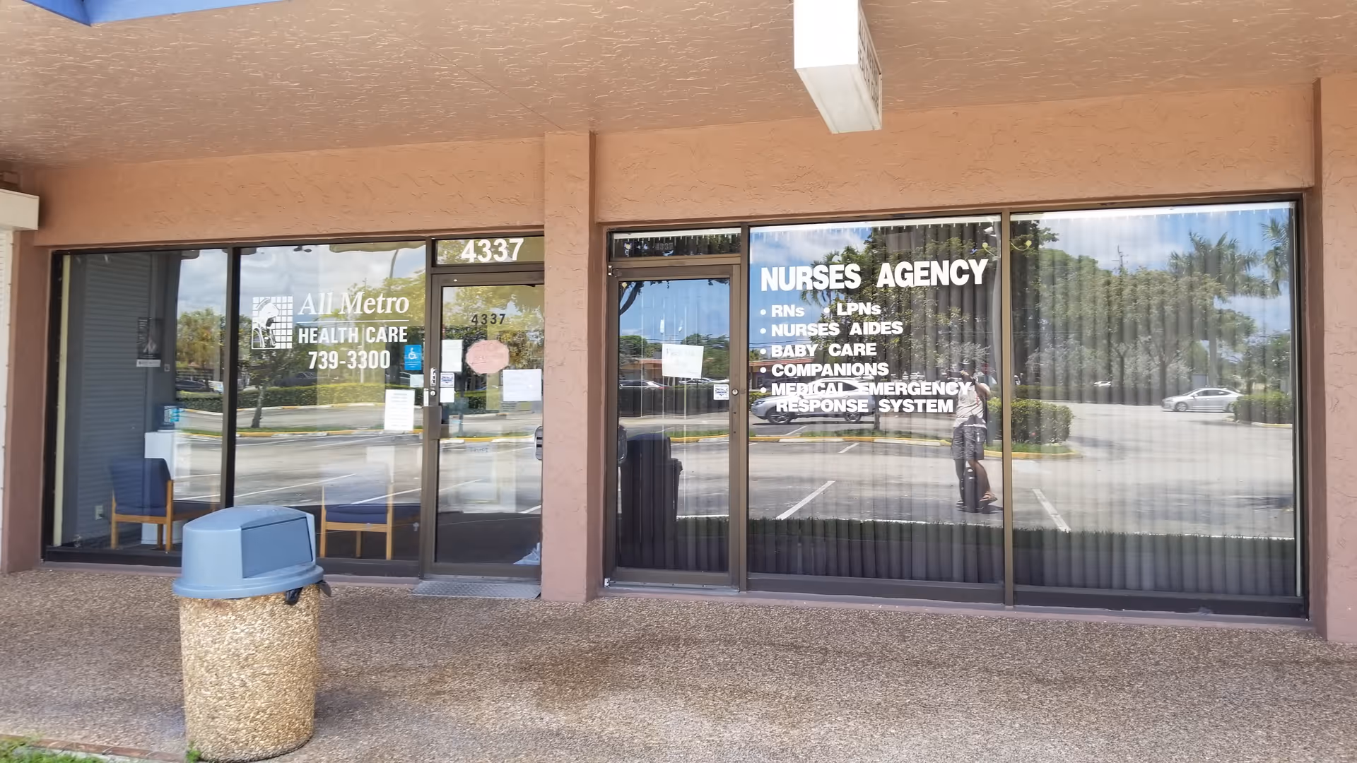 Exterior front of All Metro Health Care with glass doors and signage.