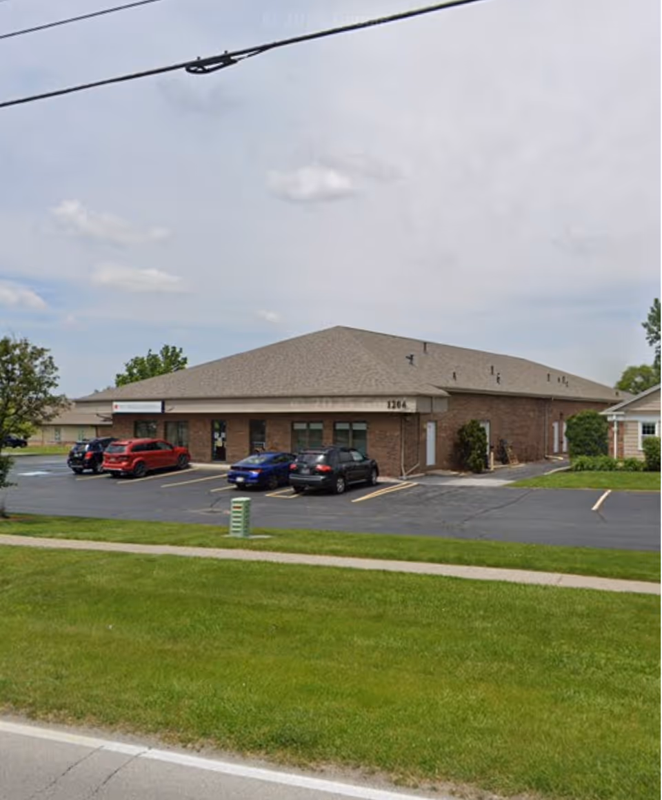 Exterior view of Hart Medical Equipment building with brick facade and a parking lot.