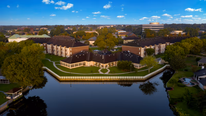 Aerial view of Young's Care Home II campus beside a large lake.