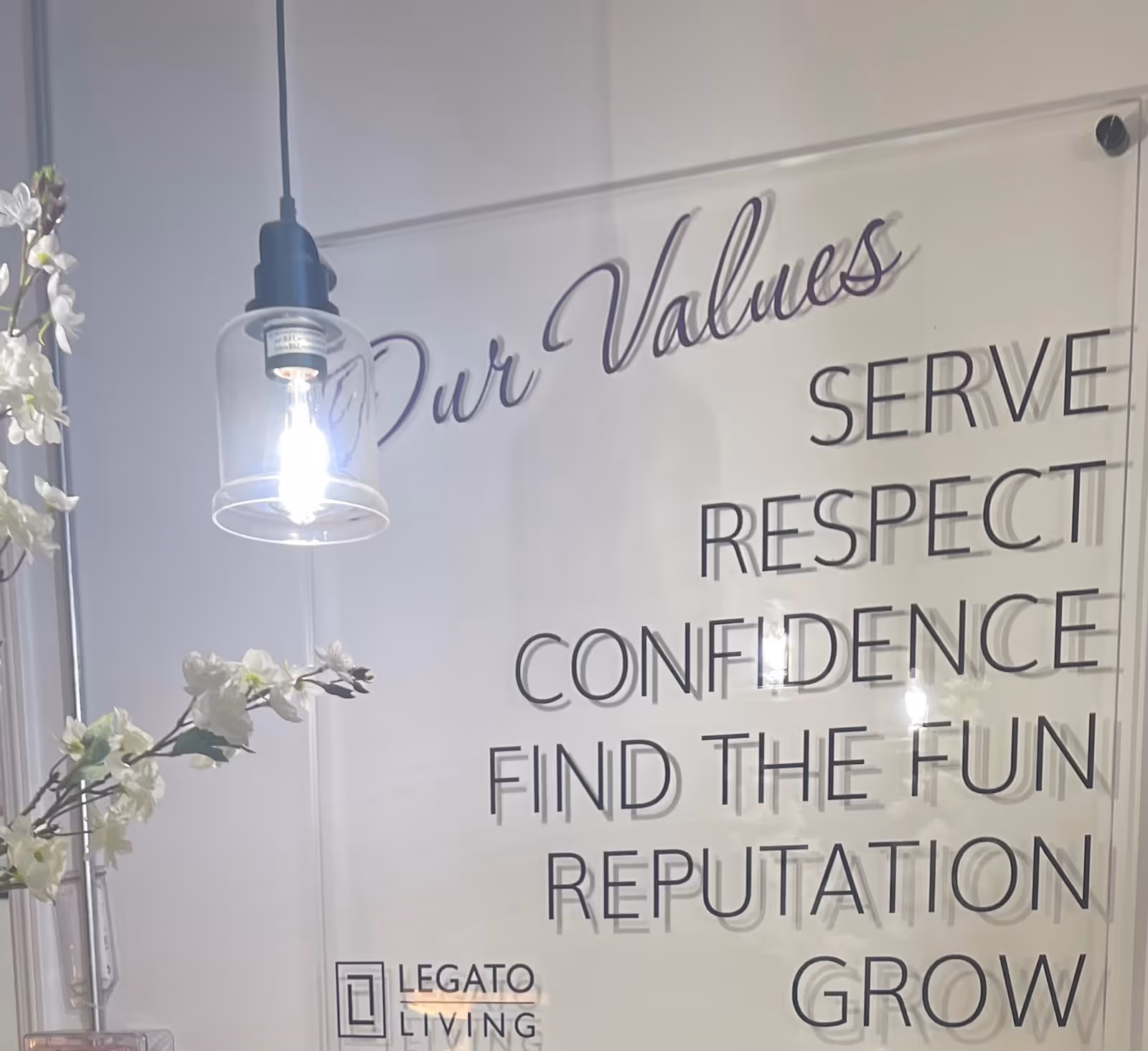 Interior wall with large 'Our Values' signage and Legato Living logo.