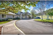 Bridgewood Rivers Assisted Living exterior with curved driveway and entrance.