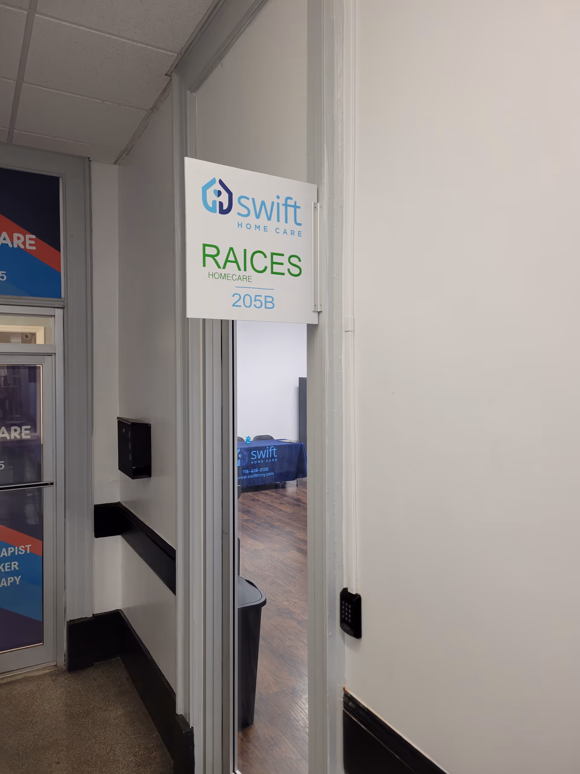 Swift Home Care Recruiting office sign visible in a hallway.