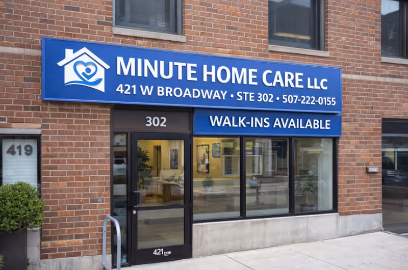 Brick storefront with blue sign reading Minute Home Care LLC and Walk-Ins Available.