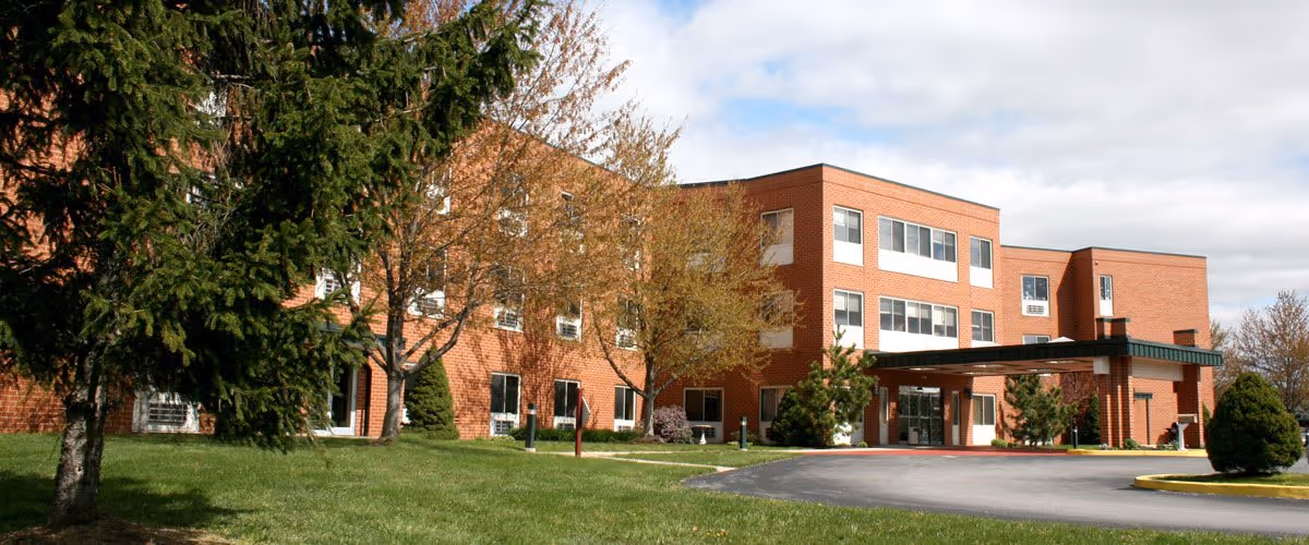 Exterior view of Shippensburg Health Care Center, a brick building with a covered entrance.