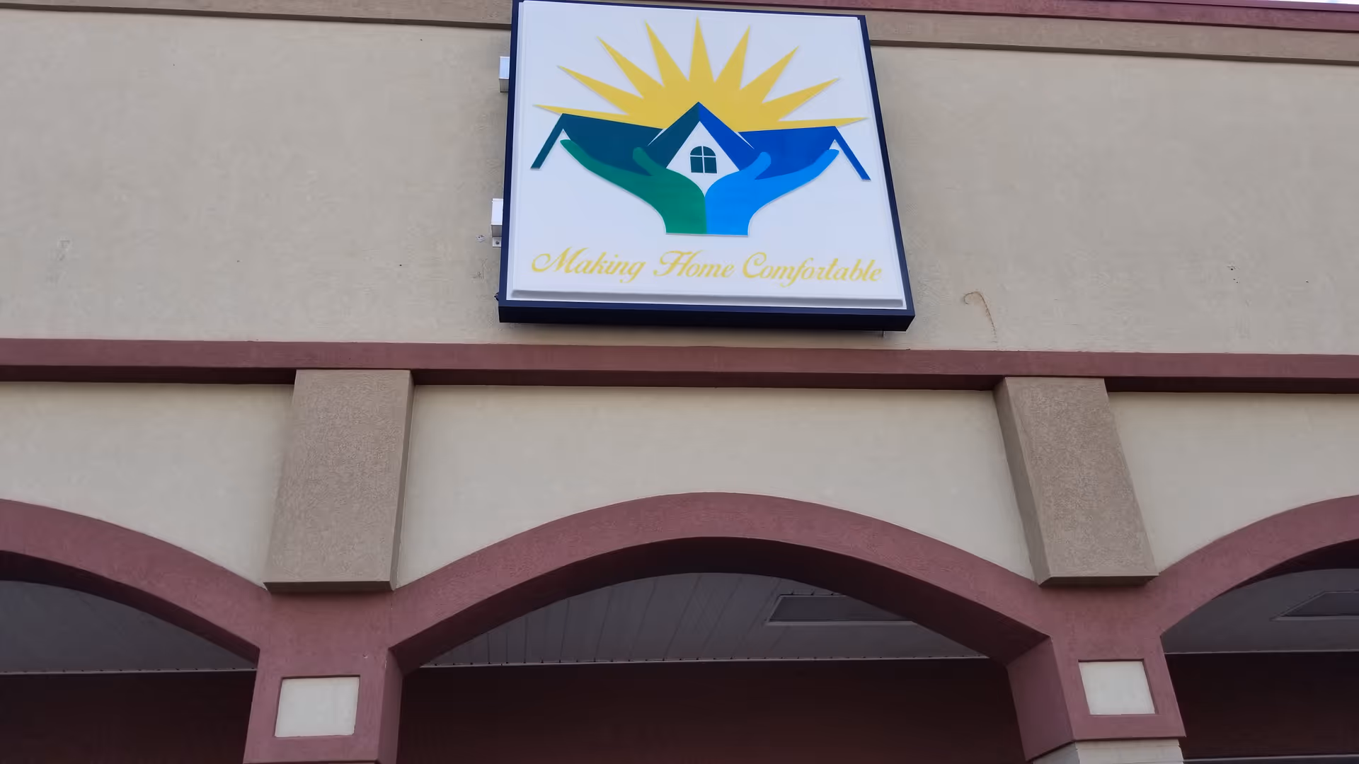 Exterior building facade featuring a large colorful sign for Center Home Care LLC.