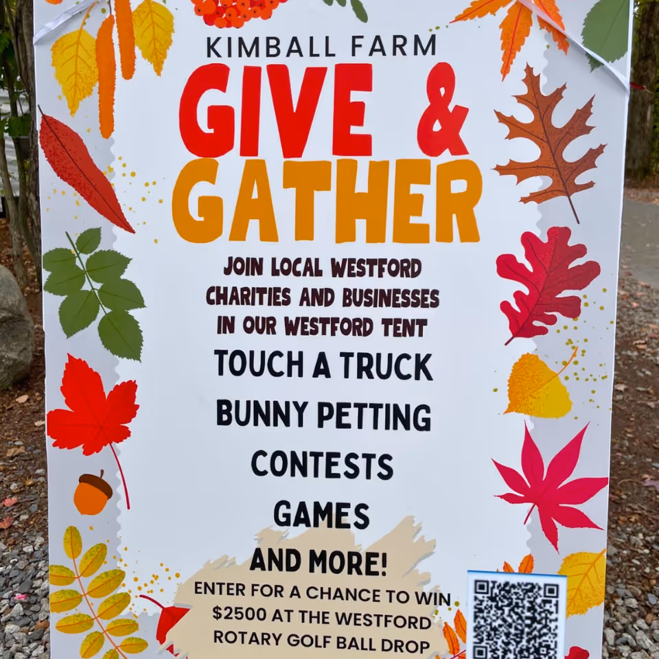 Outdoor signboard advertising Give and Gather event with autumn leaf design.