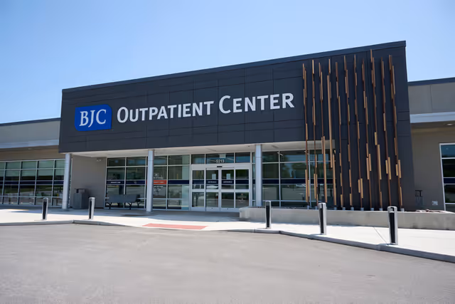 Front exterior of a modern BJC Outpatient Center building with glass entrance.