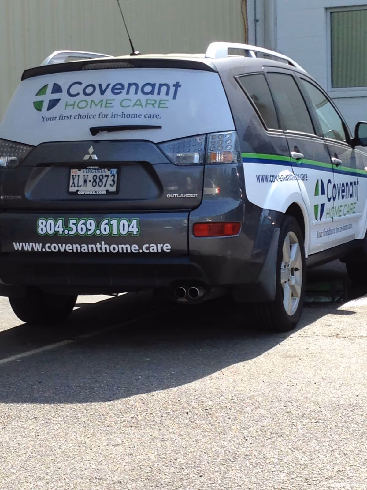 Covenant Home Care van parked outside a building, displaying logo and contact information.