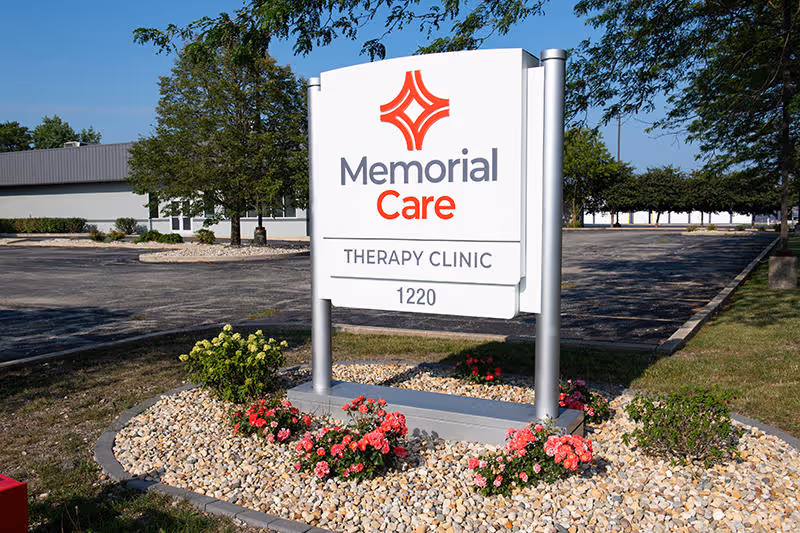 Memorial Care Therapy Clinic sign with landscaping and parking area