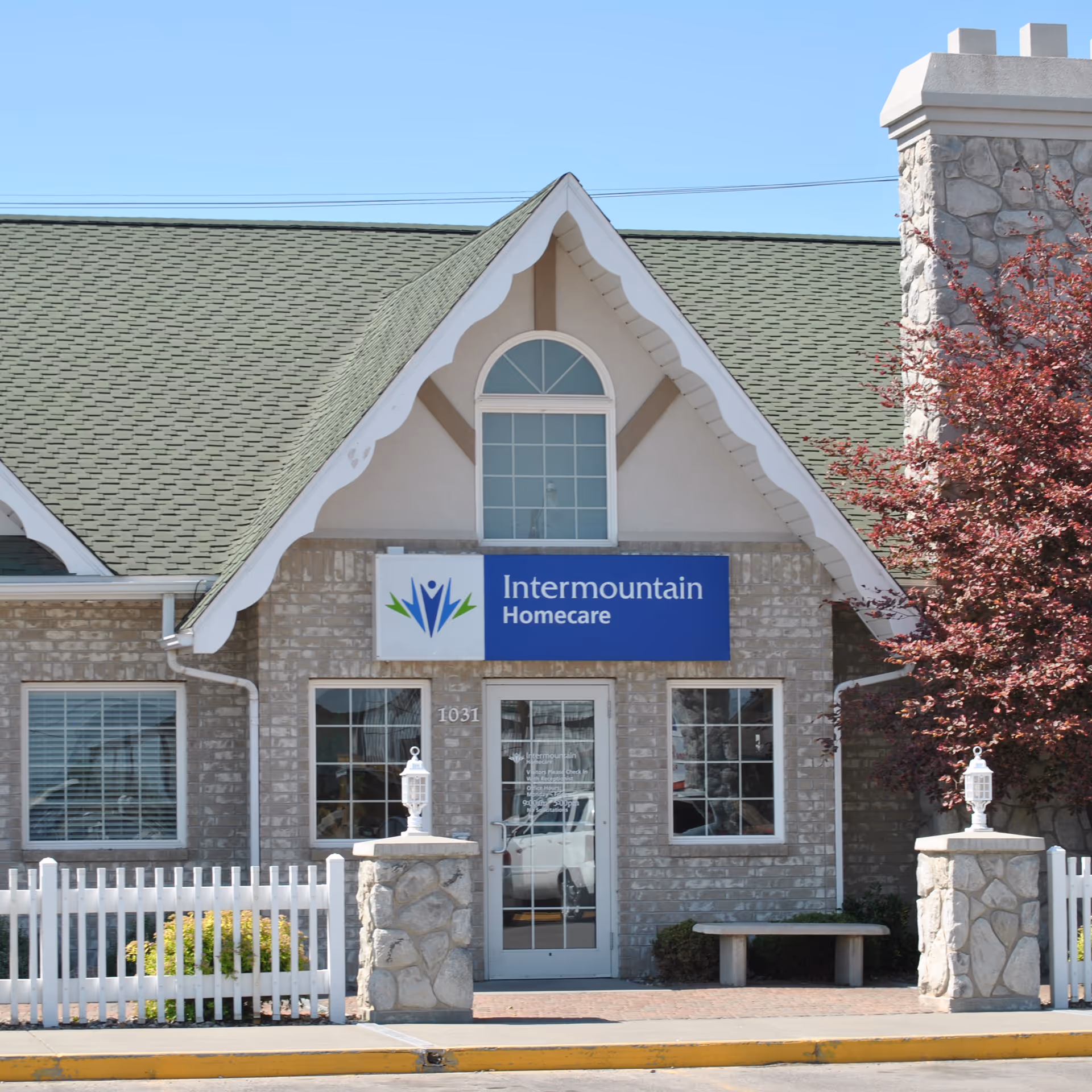 Front view of Intermountain Homecare building with sign and stone facade.