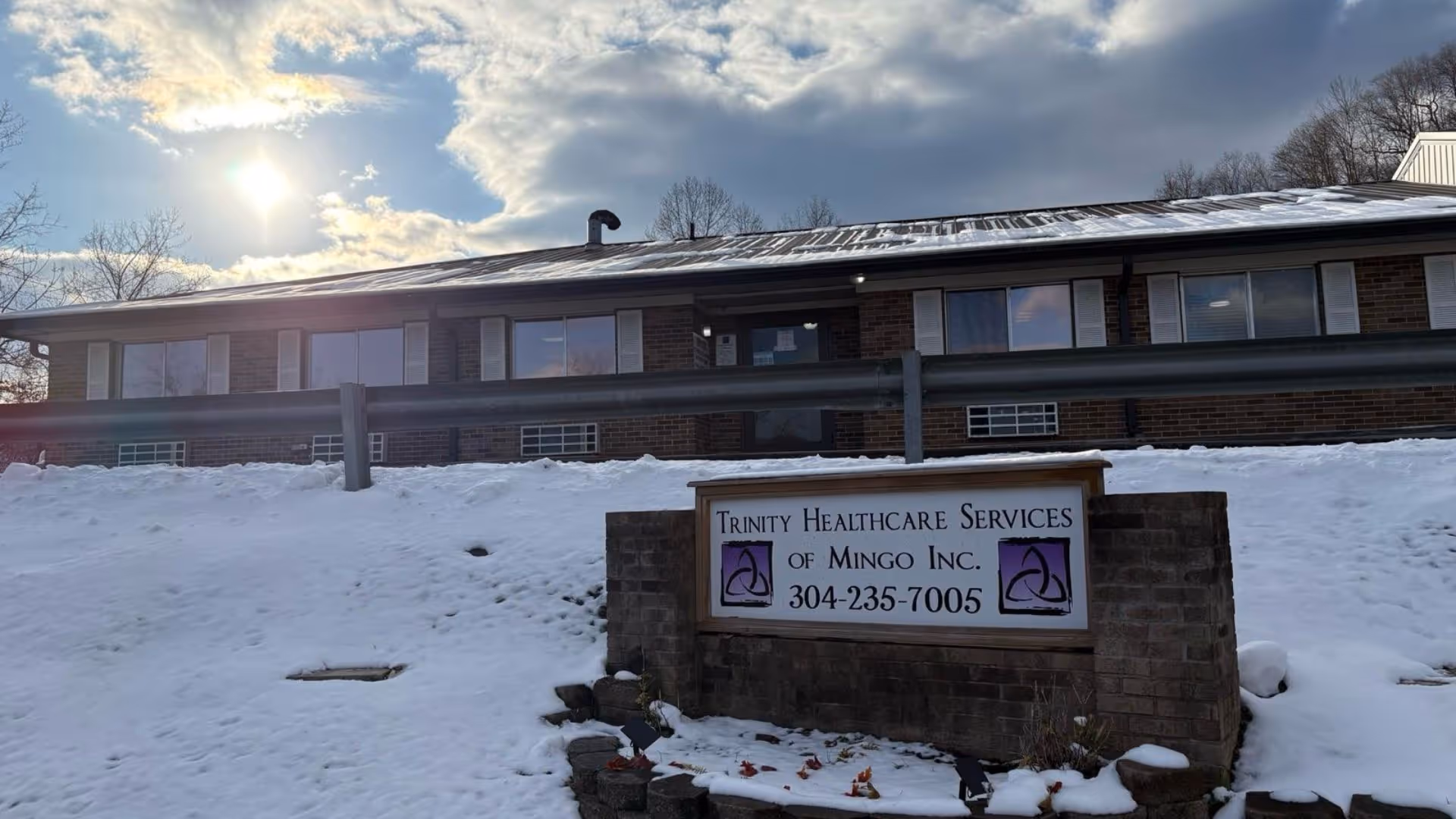 Exterior view of Trinity Healthcare Services of Mingo with a snow-covered front and sign.