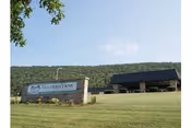 Front exterior of Mountain View Rehabilitation and Senior Living Center with its sign on the lawn.