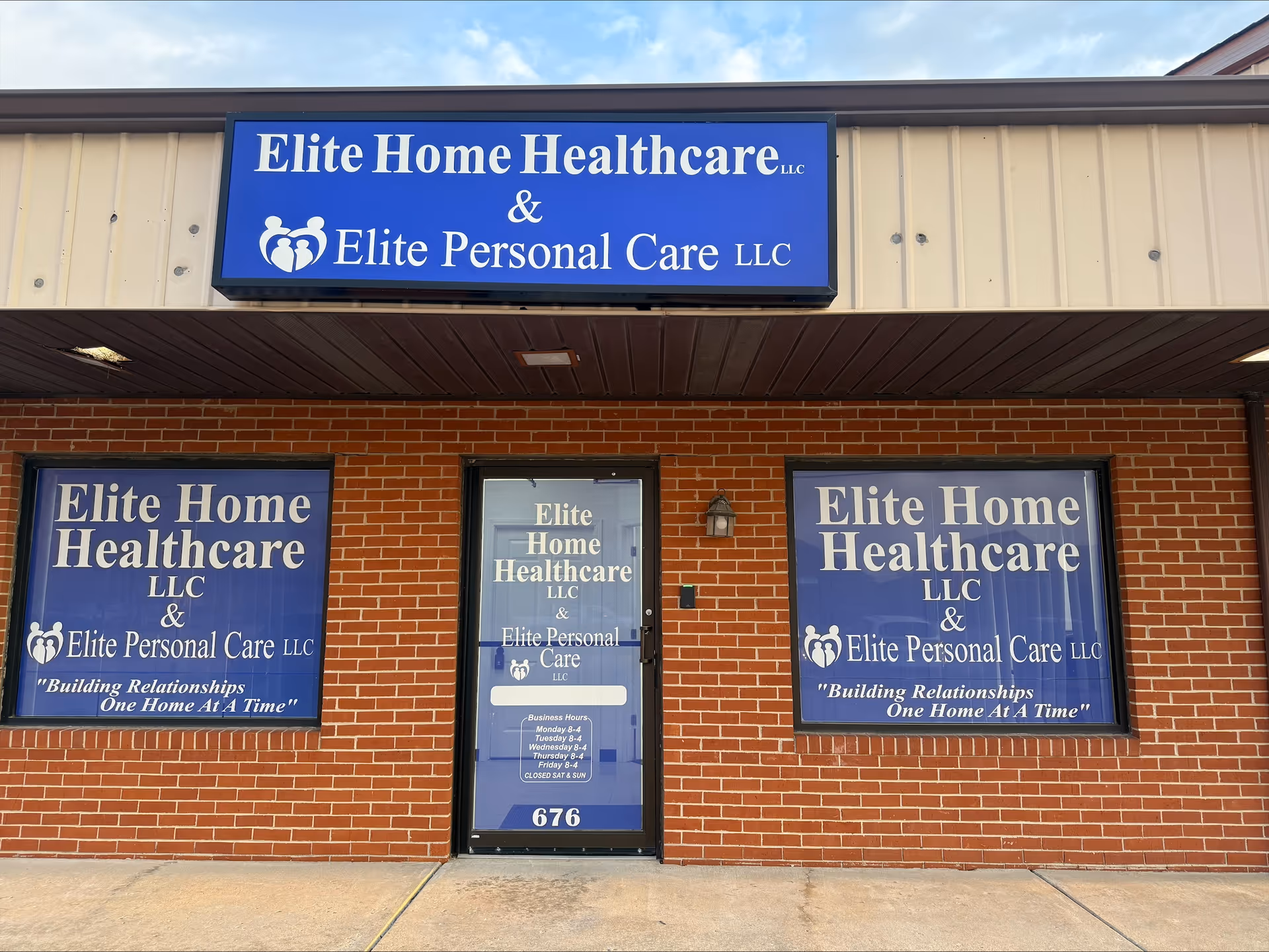 Exterior brick storefront with blue Elite Home Healthcare and Elite Personal Care signs