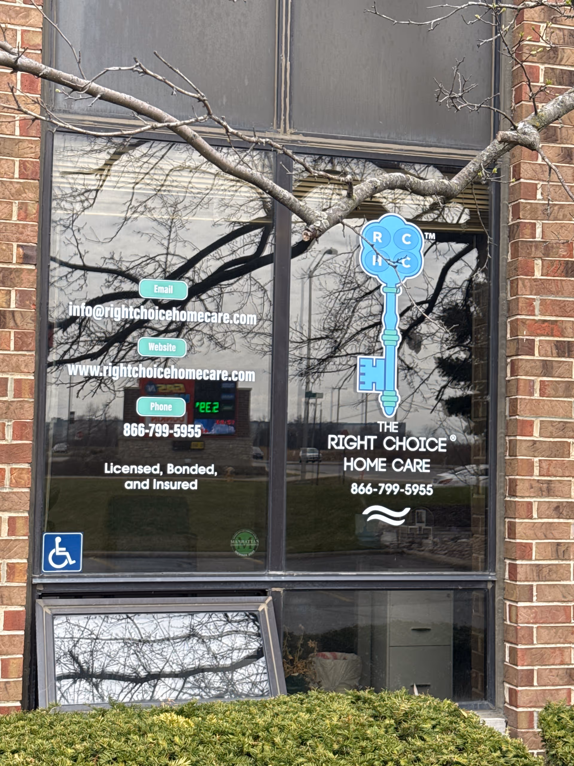 Front windows of Right Choice Home Care storefront with logo, contact details, and accessibility symbol.