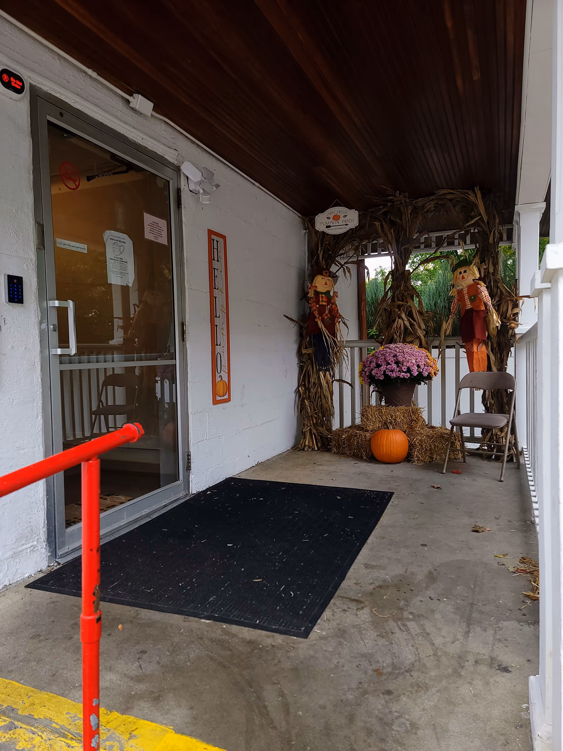 Entrance to Star Manor of Northville with autumn decor on the porch.