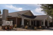 Front exterior view of Thomas Rest Haven, a single-story senior living facility with a covered entrance.