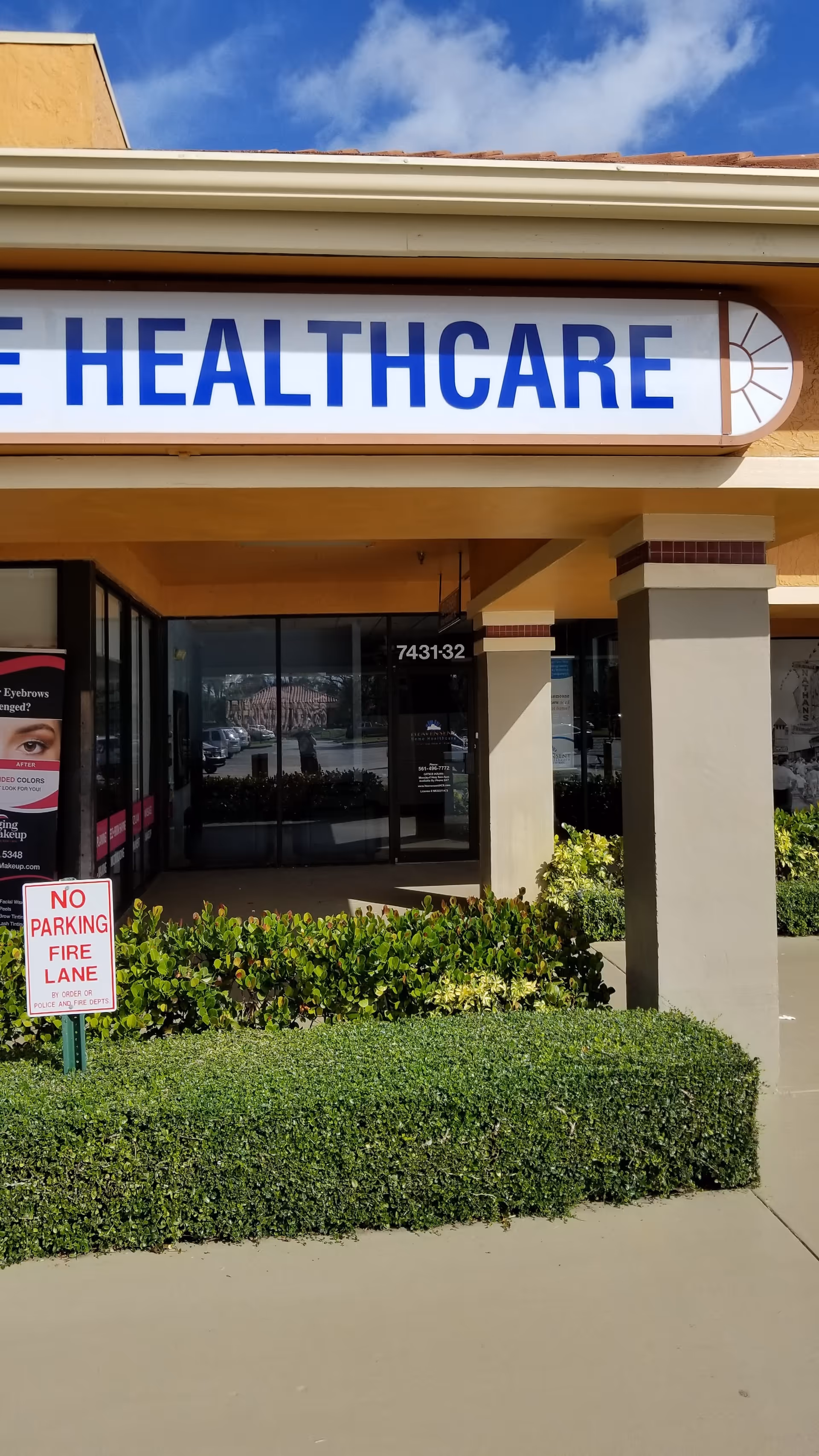 Front exterior of a building with a large HEALTHCARE sign and glass doors.