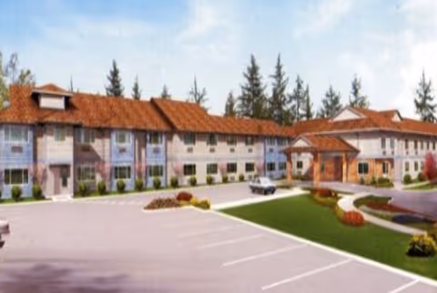 Exterior view of Chehalis West Assisted Living building with parking lot and landscaped grounds.