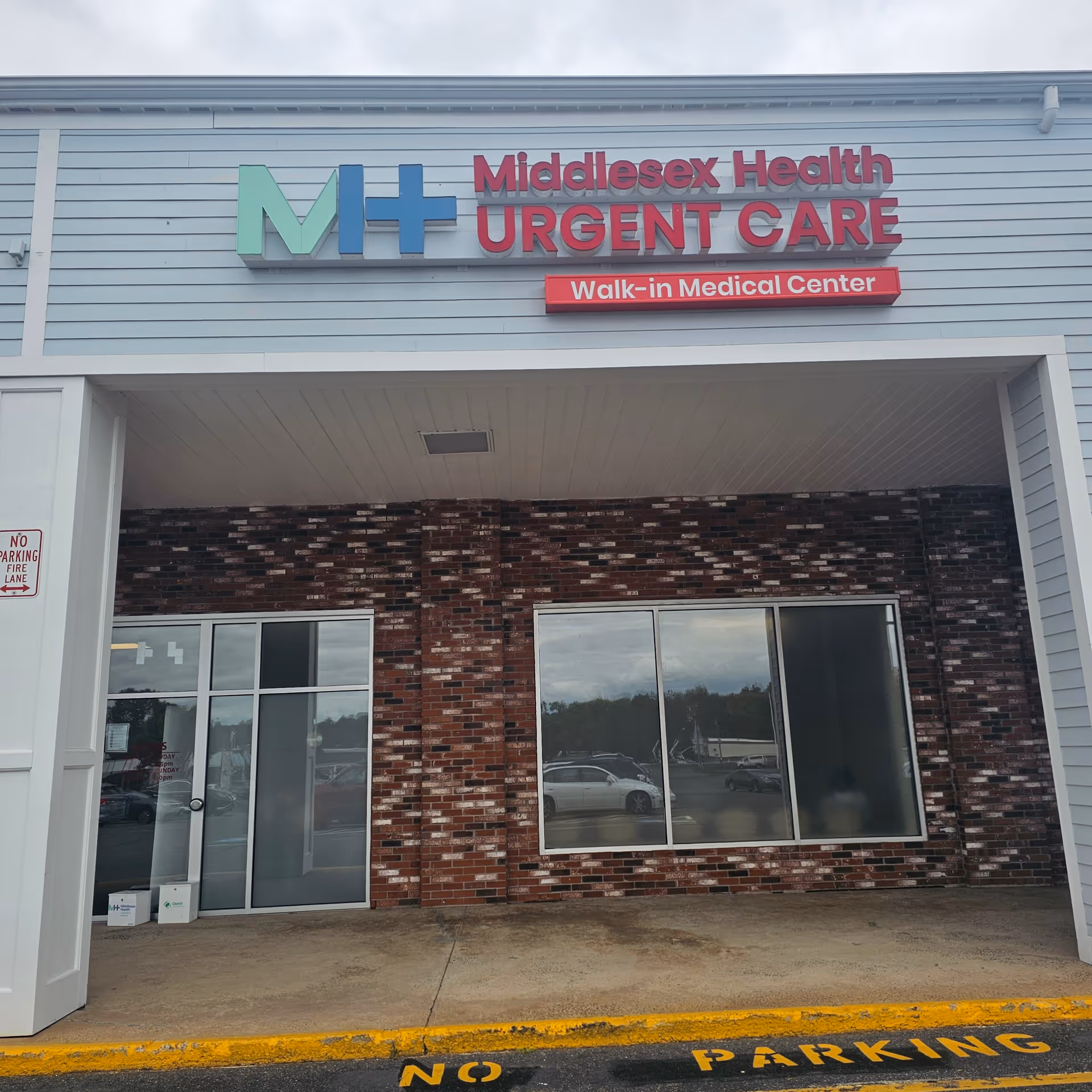 Front exterior of Middlesex Health Urgent Care Middletown with signage