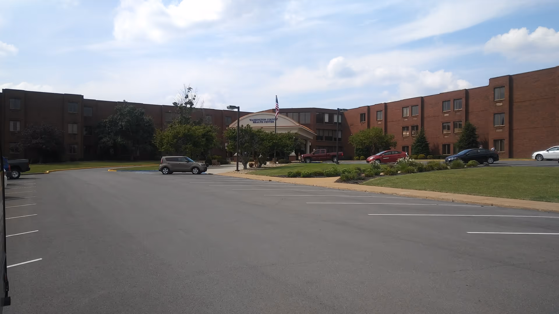 Exterior view of Washington Rehab & Nursing Center with parking and entrance.