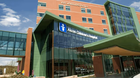 Front exterior of Akron Children's Outpatient Surgery Center with glass entrance.