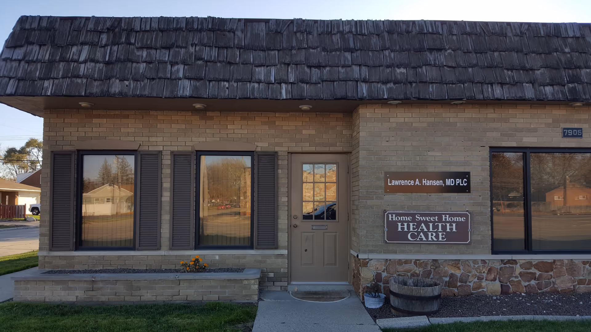 Exterior view of a single-story brick building with Home Sweet Home Health Care signage.