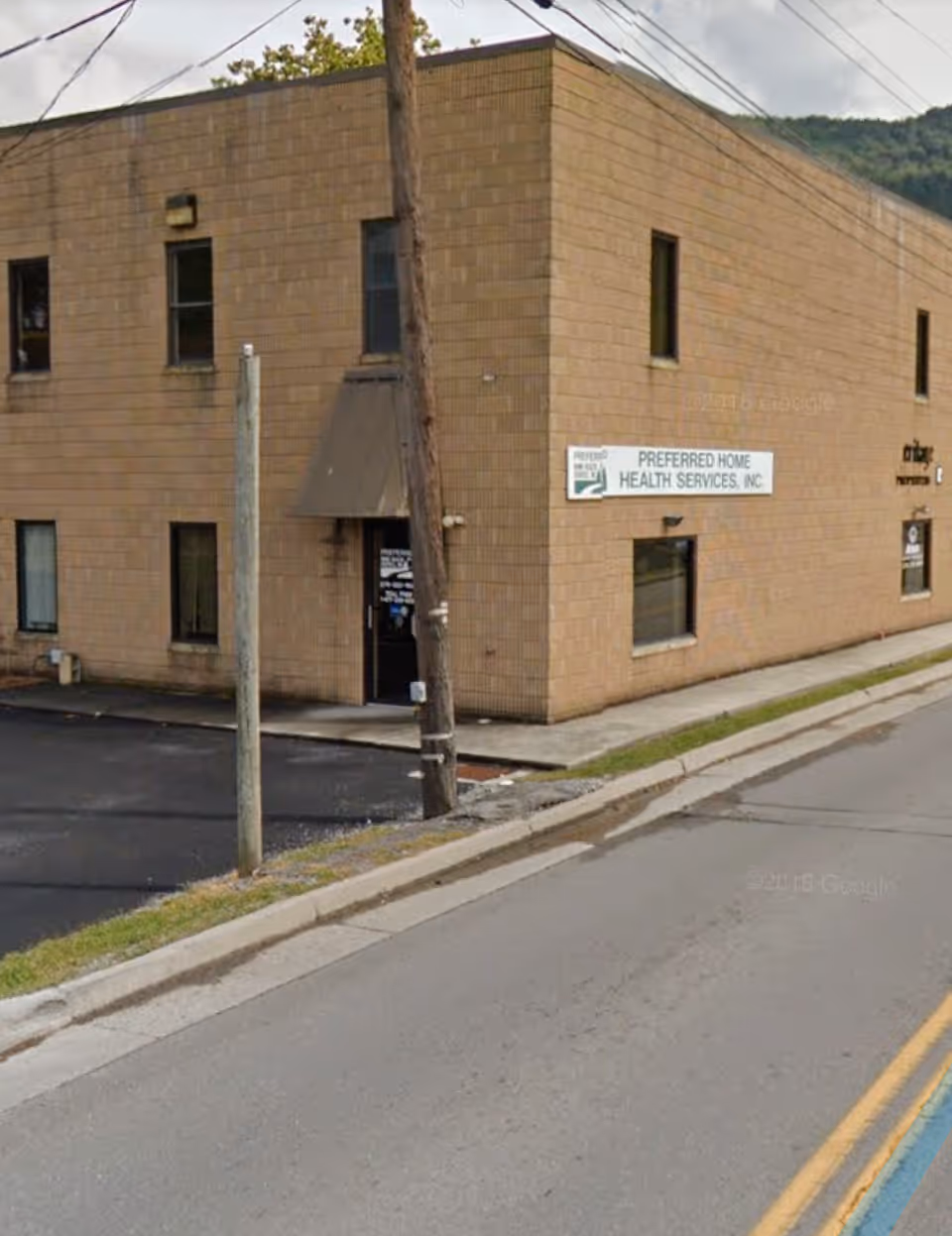 Exterior of a brick building with a sign for Preferred Home Health Care Services.