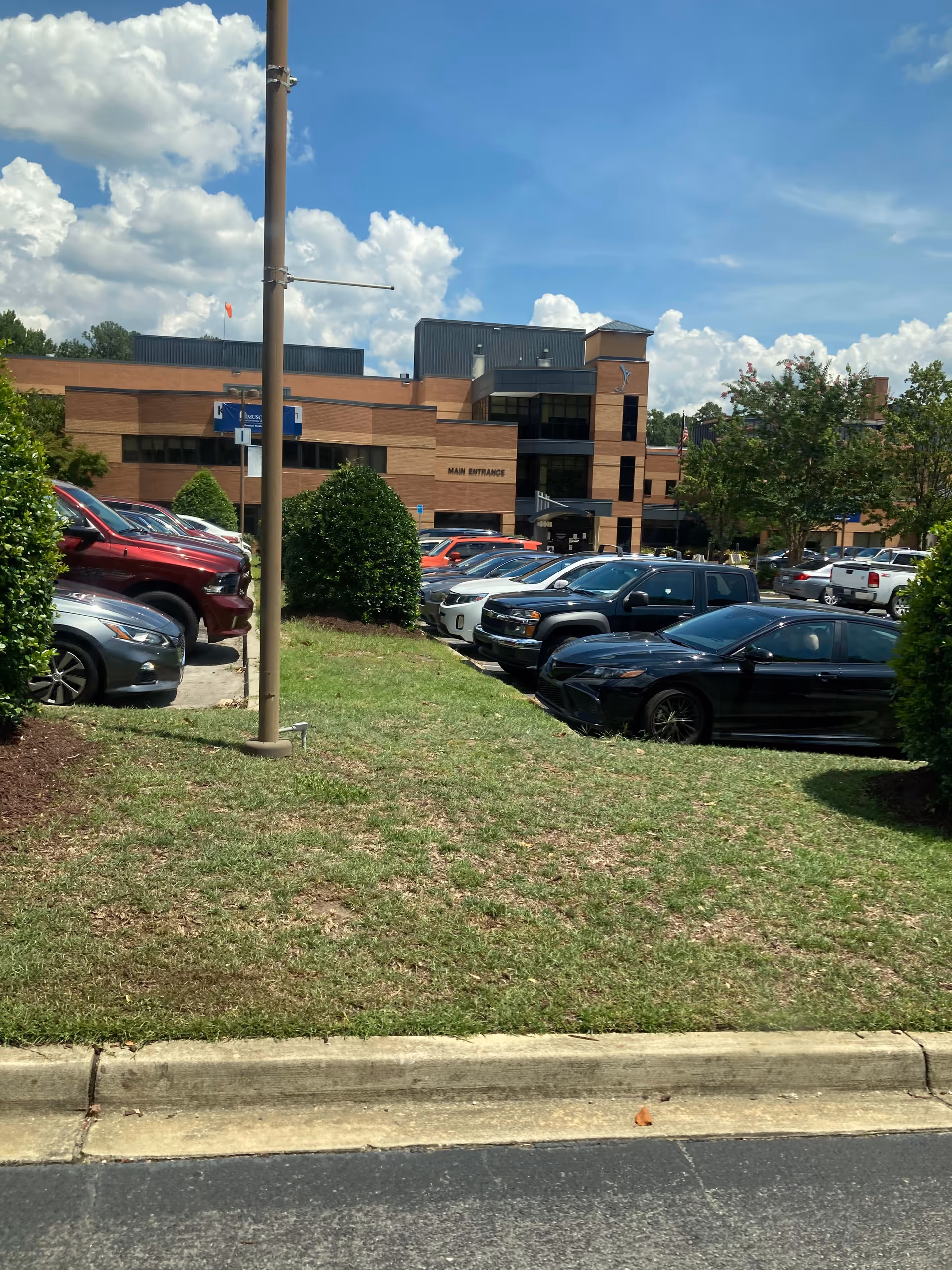Exterior view of MUSC Health Kershaw Medical Center with parking and landscaping.