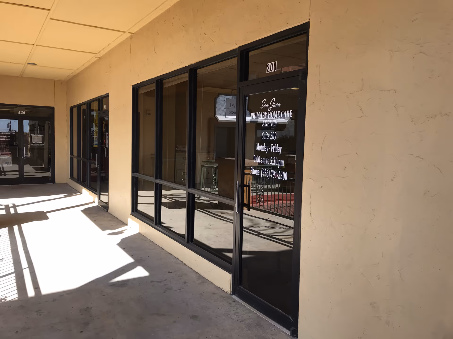 Exterior of a beige storefront with glass doors for San Juan Primary Home Care Agency.