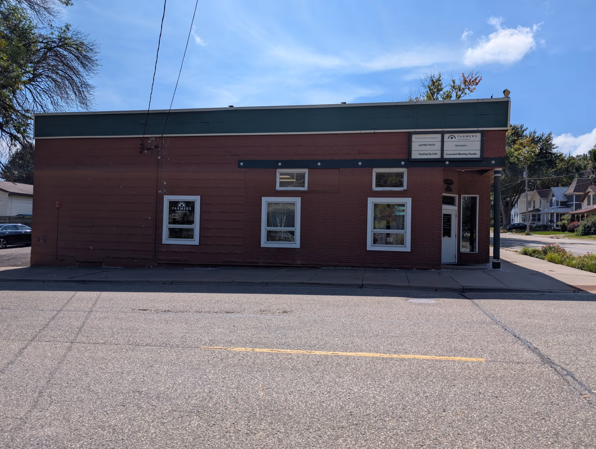 Exterior view of Kangas Road LLC building along a quiet street.