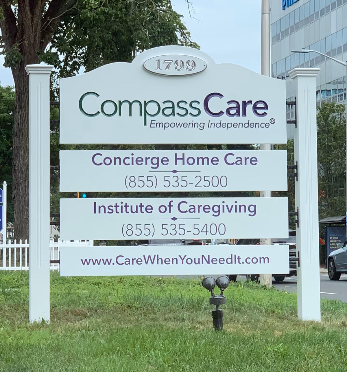 Large Compass Care sign outside listing Concierge Home Care and Institute of Caregiving