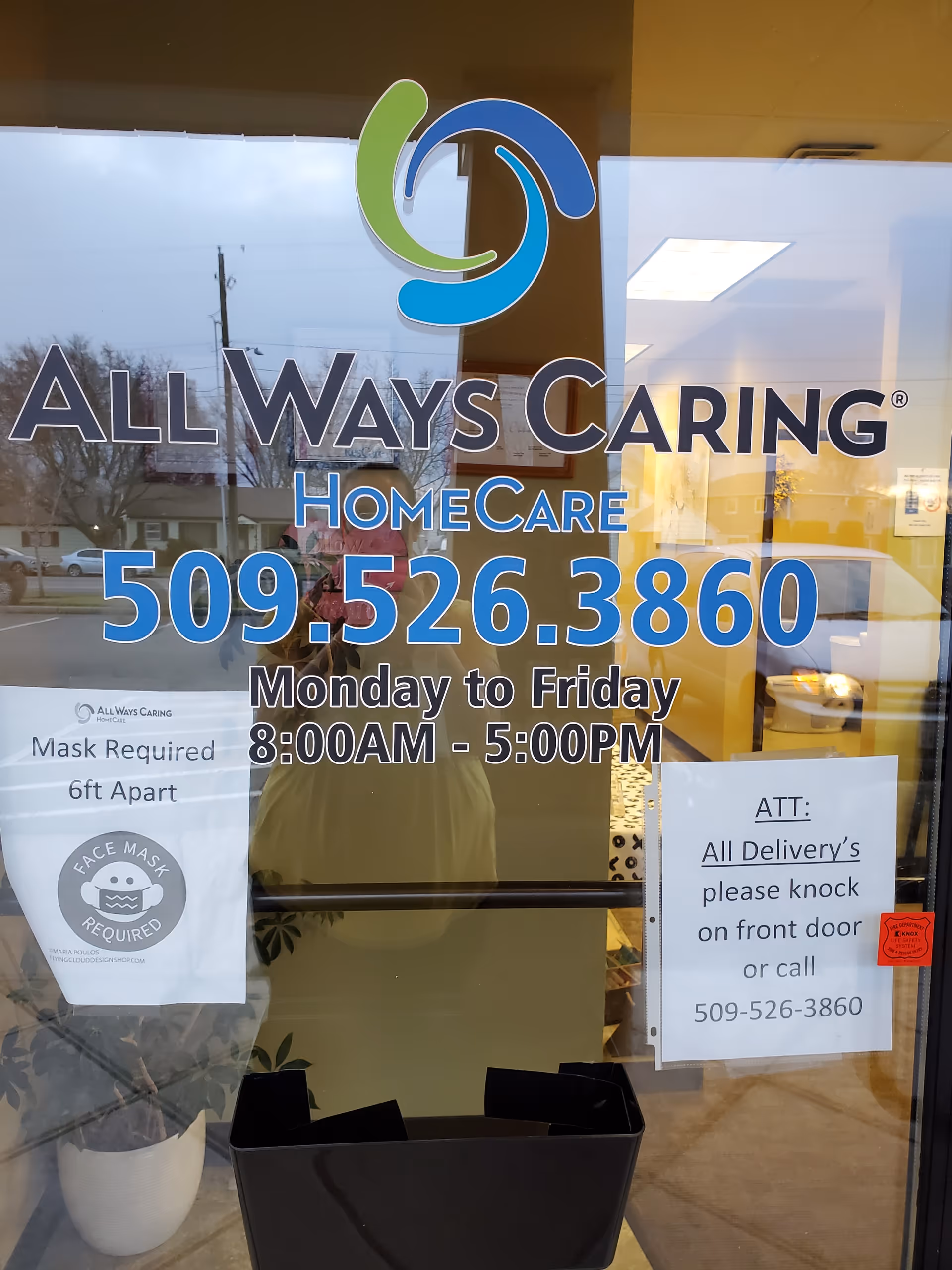 Front glass door displays All Ways Caring HomeCare logo, phone number, hours, and signs.