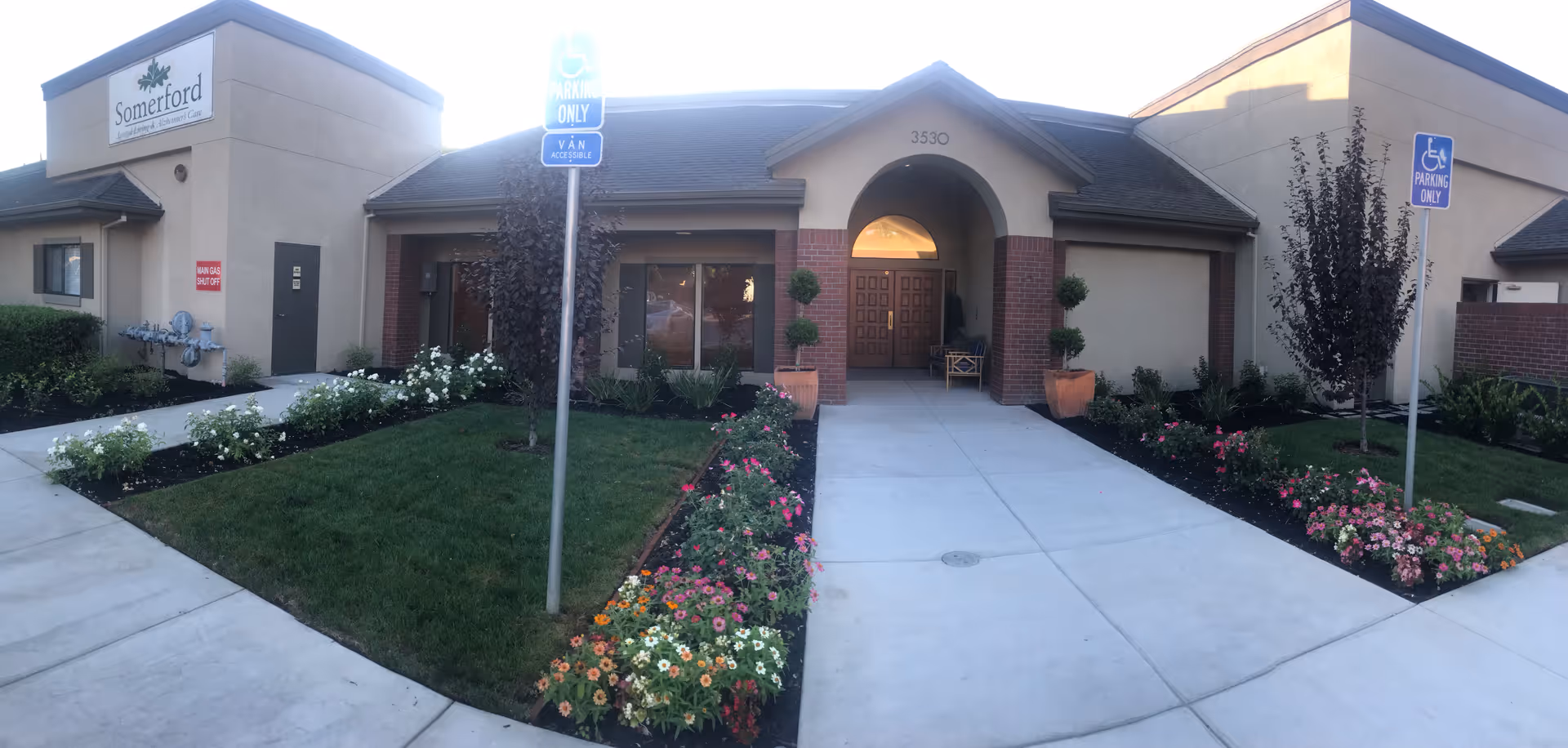 Exterior view of Summerfield of Stockton entrance with walkway and landscaping.