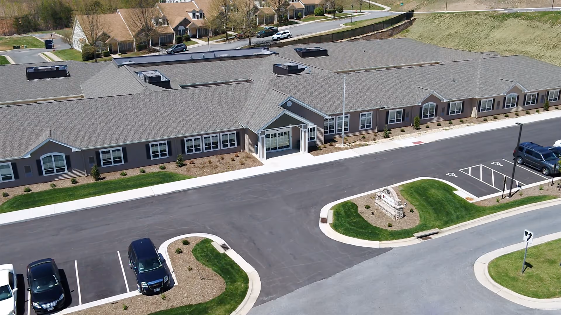 Aerial view of Runk & Pratt Pearls of Life at Liberty Ridge exterior with parking.