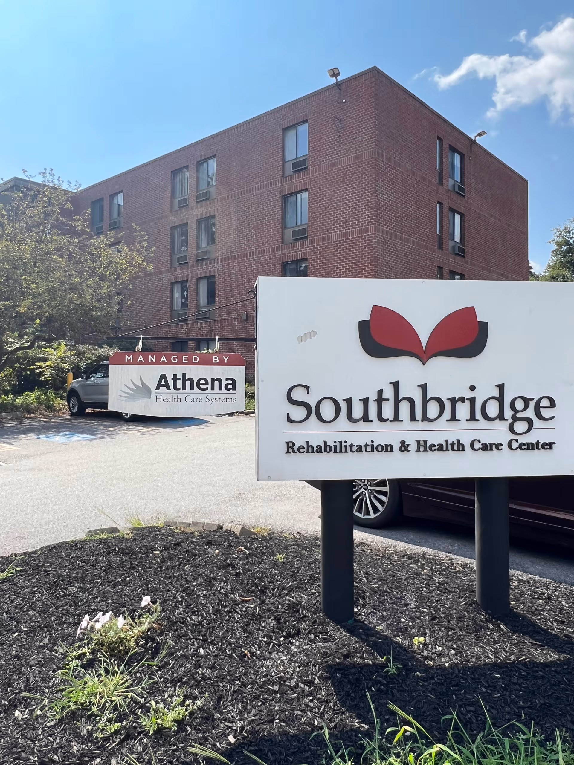 Exterior view of Southbridge Rehabilitation and Health Care Center with a prominent front sign