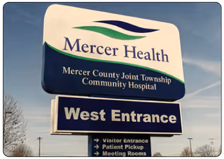 Mercer Health sign with West Entrance at the facility's exterior.