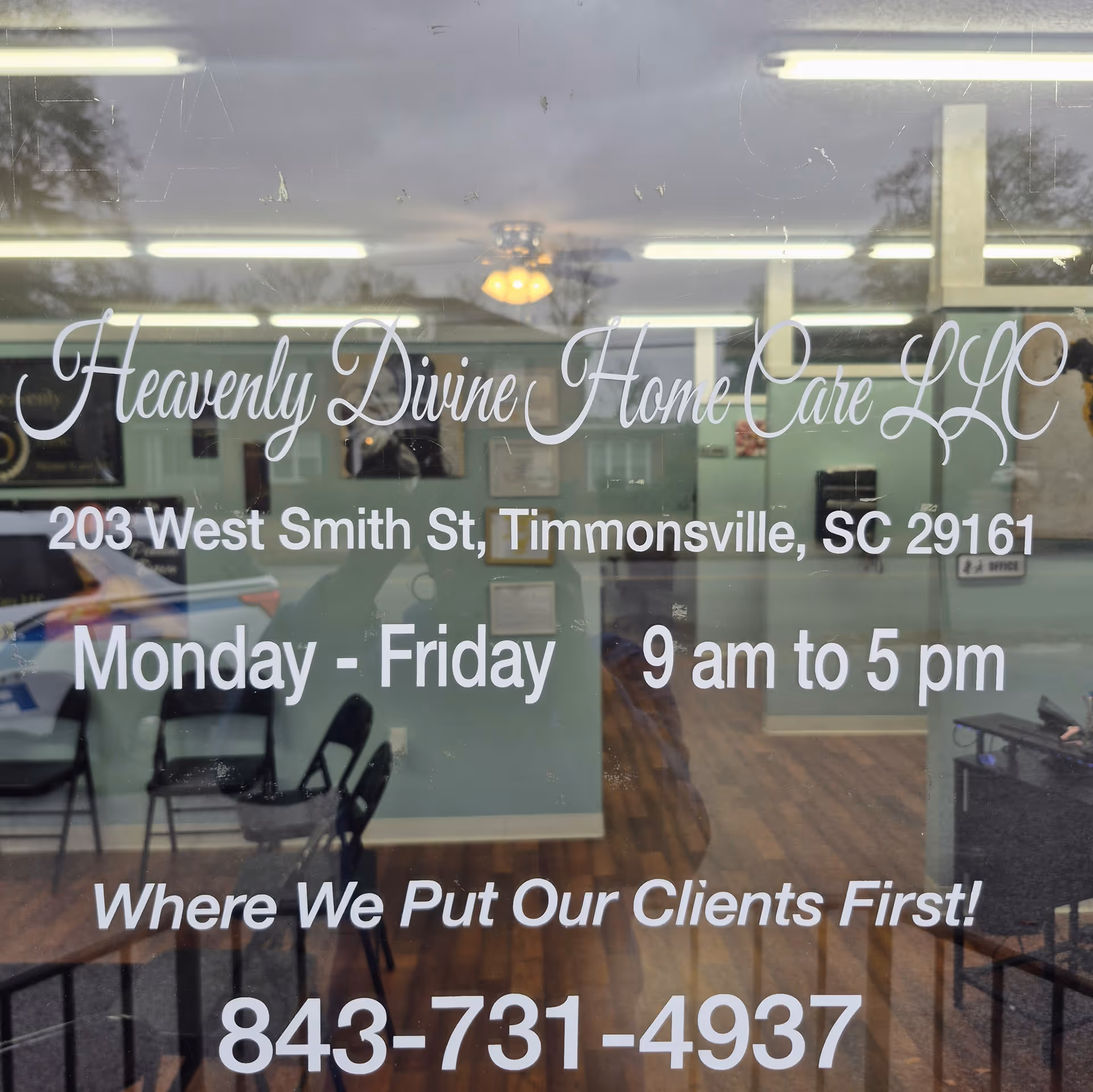 Glass storefront shows Heavenly Divine Home Care LLC sign and office interior.