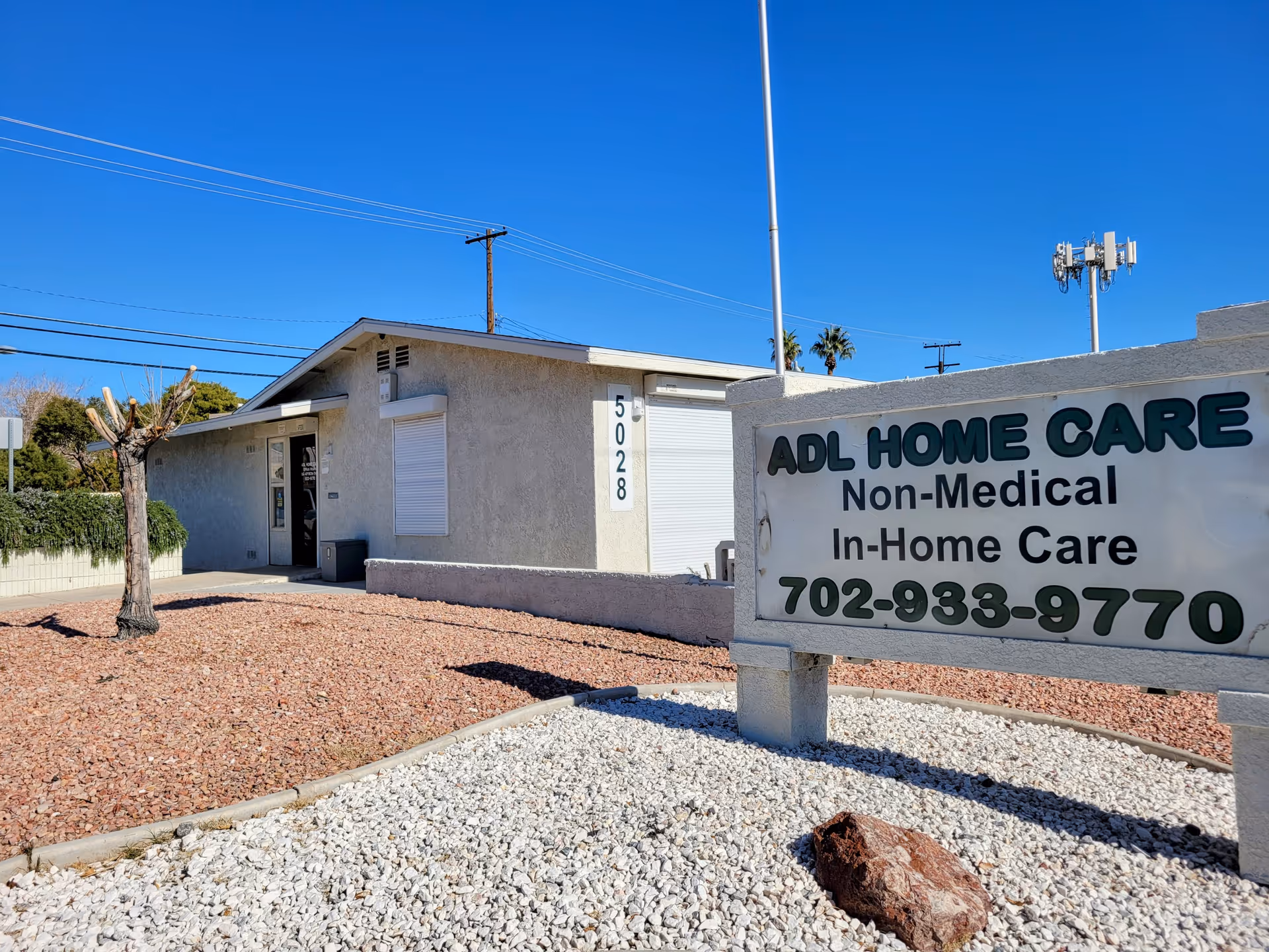 Exterior view of ADL Home Care building and sign.