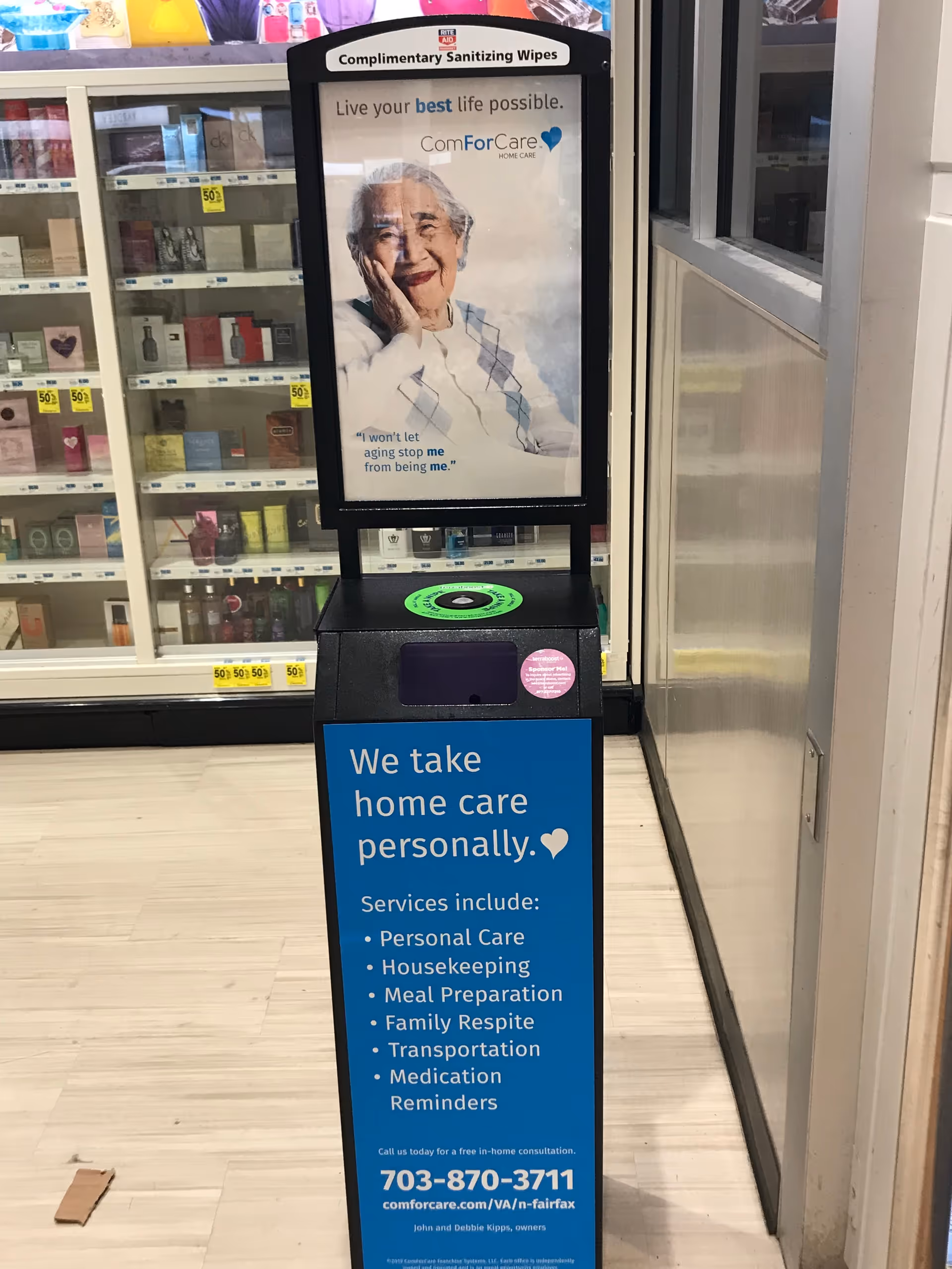 Blue information display with ComForCare home care ad in a store aisle.