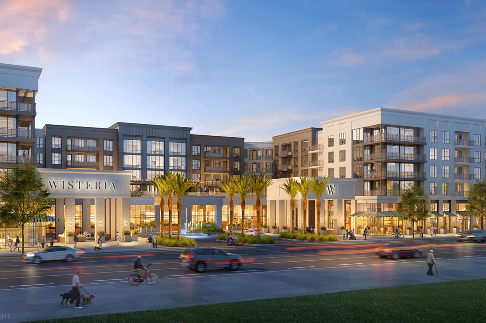 Exterior front view of the Wisteria at Warner Center multi-story senior living building with palm trees, a fountain, street traffic and pedestrians at dusk.