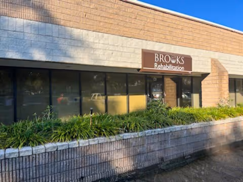 Exterior view of Brooks Rehabilitation Home Health Ocala storefront with landscaping.