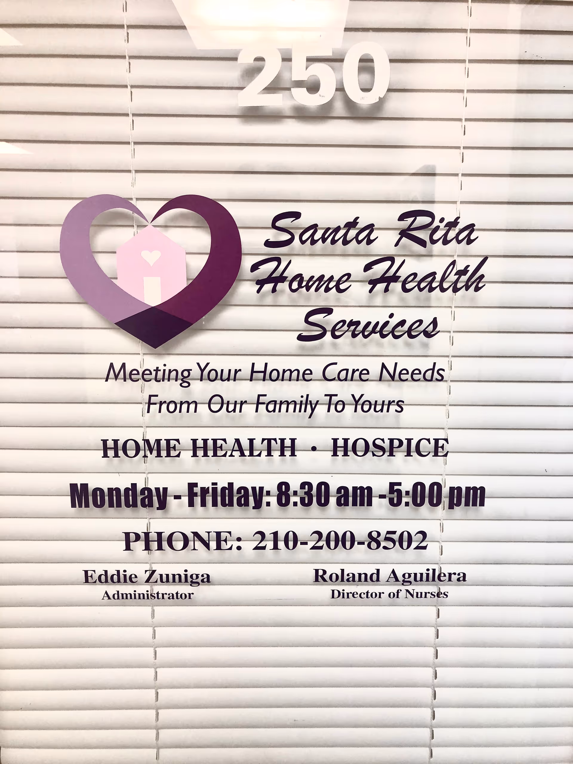 Storefront window sign for Santa Rita Home Health Services with logo and hours.