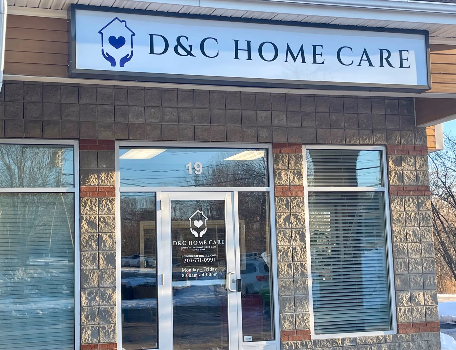 Exterior view of a D&C Home Care building with a sign above the entrance.