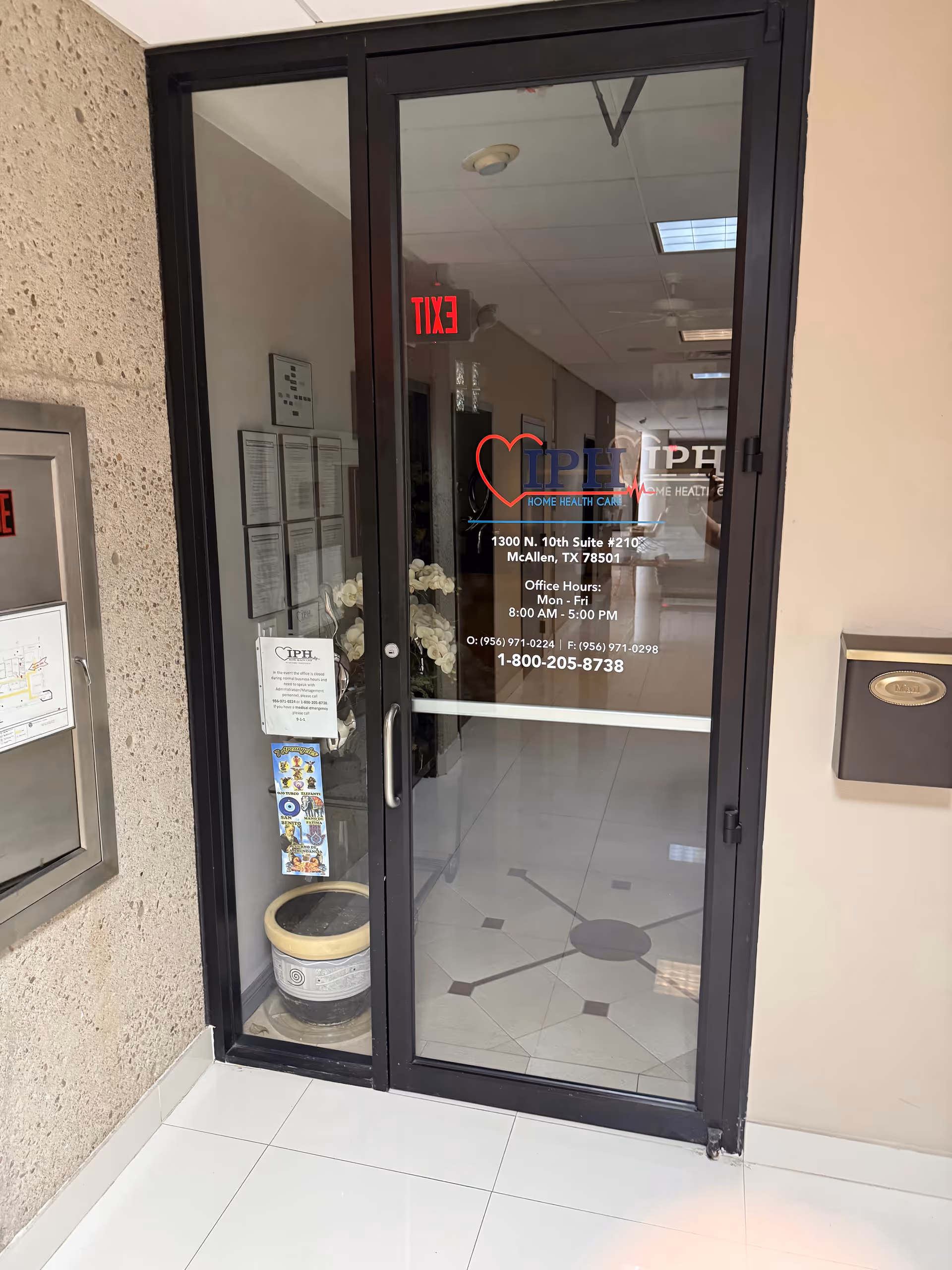 Glass door entrance to IPH Home Health Care with interior hallway beyond.