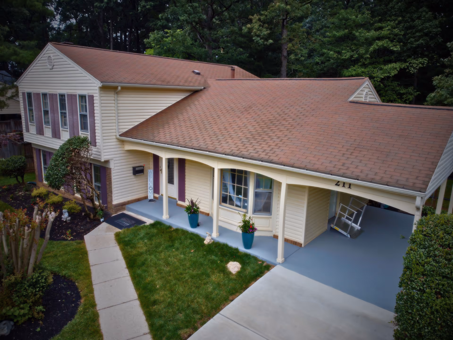 Exterior view of a beige senior living facility with a welcoming entrance.