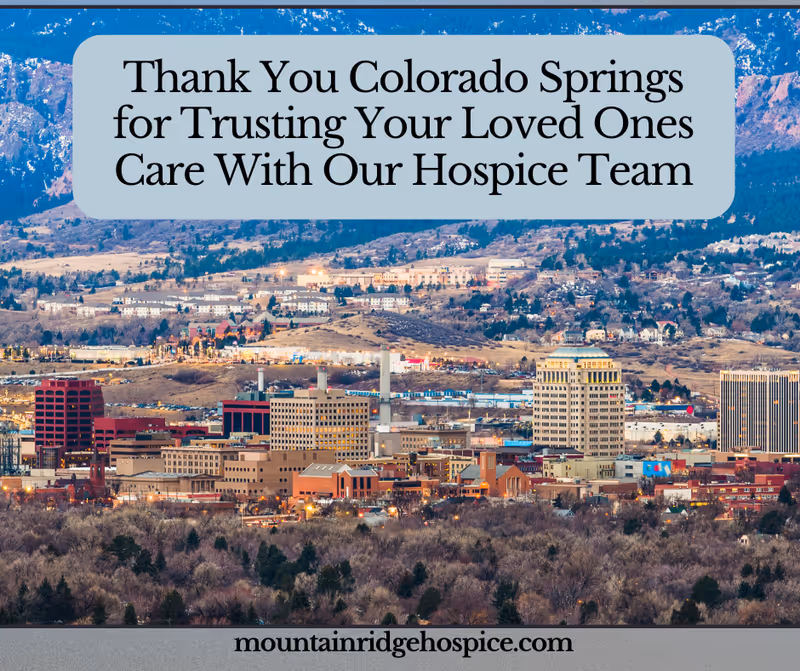 A city skyline features a hospice promotional banner thanking Colorado Springs.